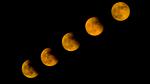 A totally eclipsed Moon can be red in color. A Total Lunar Eclipse happens when the Earth moves in between the Sun and the Moon.