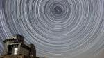Star trails over an observatory.