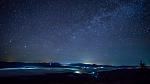 A New Moon night is a good time to star gaze. Starry night sky over the mountain city in the fog