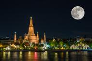 Supermoon in Bangkok, Thailand Wat arun in night with super full moon