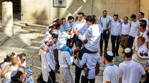 A group of religious Jews celebrate Simchat Torah.
