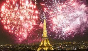 Eiffel tower Paris, France at night with fireworks.