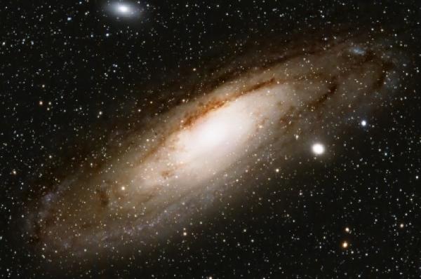 This is a picture of our neighbour galaxy, in the constellation Andromeda(also designated M31). The galaxy at a distance of 2.25 million light-years consists of 200 billion stars.