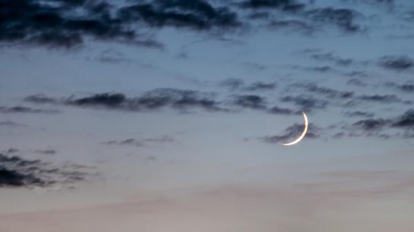 A Waxing Crescent Moon in the evening.
