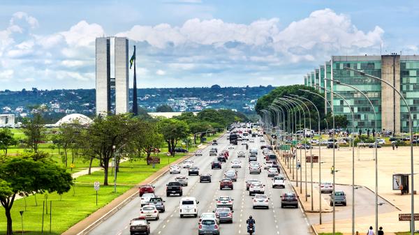 View of traffic on street next to Congresso Nacional (National Congress) building in Brasilia, capital of Brazil.