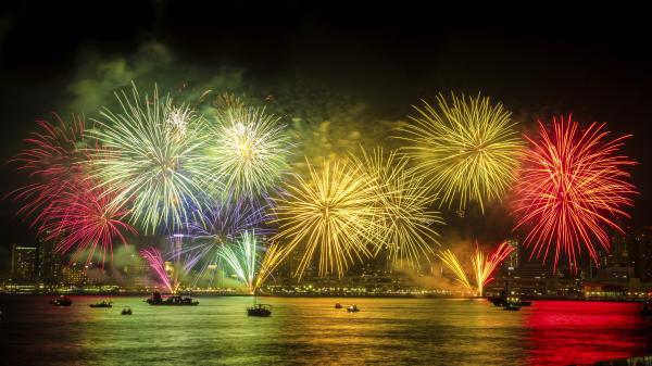 Fireworks illuminate a river in Japan.