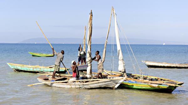 Haitian fishermen in their boats preparing for a day of fishing off the shore near Saintard, Haiti.