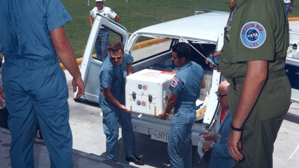 The first Apollo 11 sample return container, containing material collected from the Moon’s surface, arrives at the Lunar Receiving Laboratory in Houston, Texas.