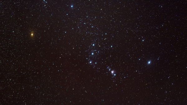 Betelgeuese glows red positioned as the shoulder in the Orion constellation.