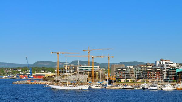 The city of Oslo hosts a myriad of tall ships and tourists during the summer Oslo in the summer seen from the seaside.