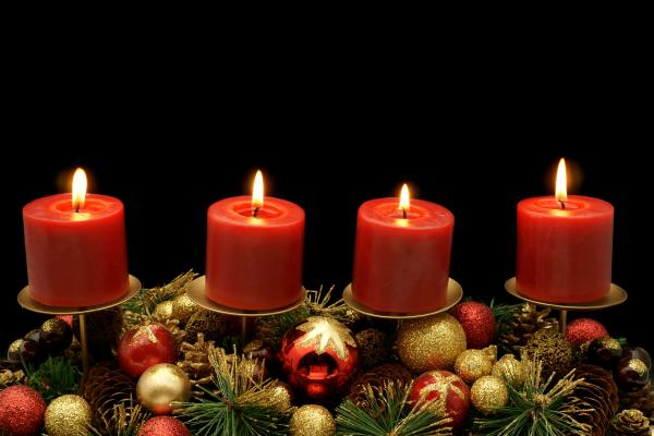 Four advent candles with decoration.