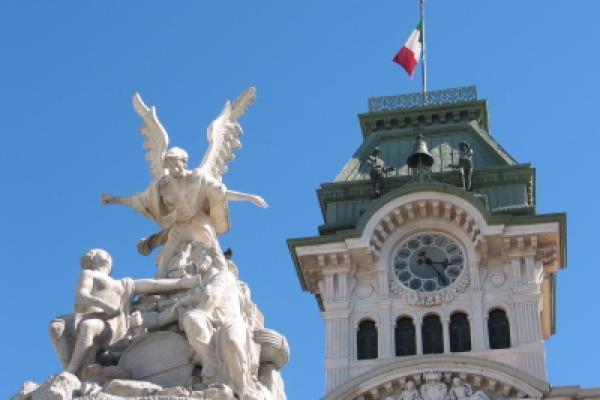 Fountain Sculpture and Town Hall with Clock. Trieste, Italy
