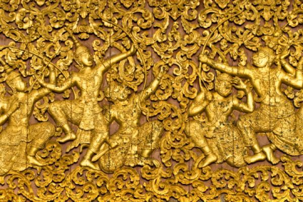 The ramayana epic carved on a wood door inside a temple. The ramayana epic carved on a wood door inside a temple.