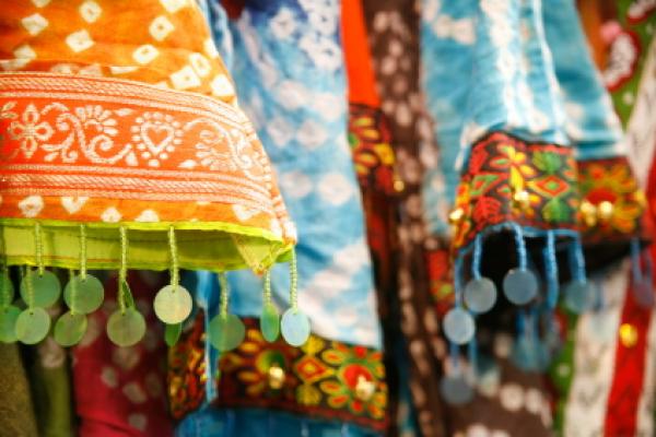 Textiles from India in a marketplace.