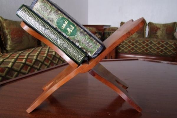 Traditional wooden holy bookstand whit the Koran Traditional wooden holy bookstand whit the Koran