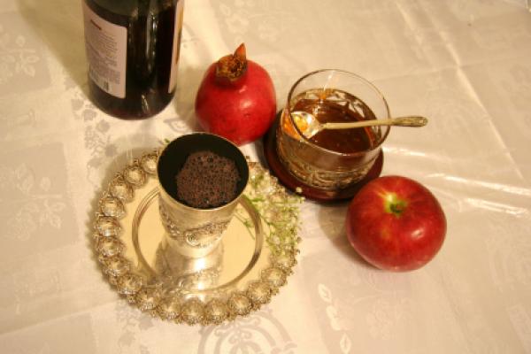 A meal set on a table for Rosh Hashana. A meal set on a table for Rosh Hashana.