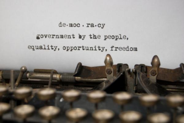 Definition of democracy typed on a typewriter.