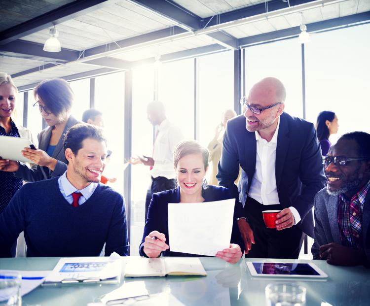 Happy employees in a sunlit room. Click to see more detail. Happy employees in a sunlit room.