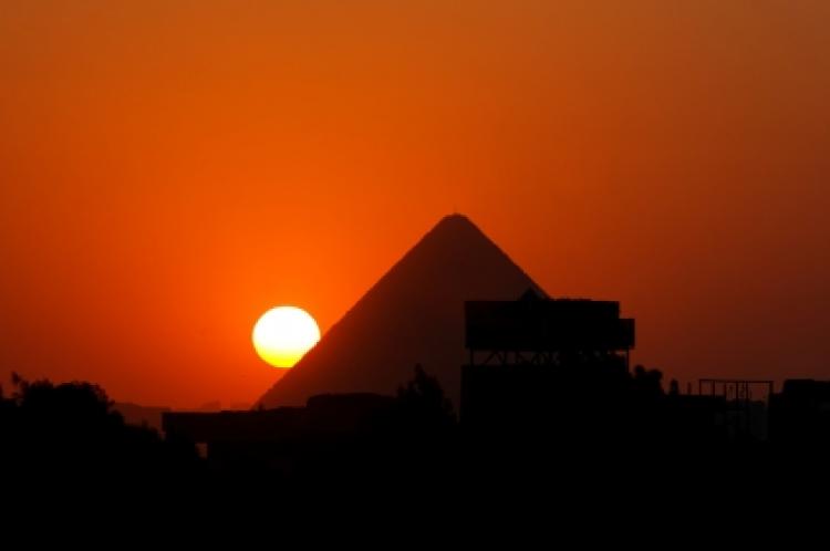Sunset behind the pyramid of Cheops