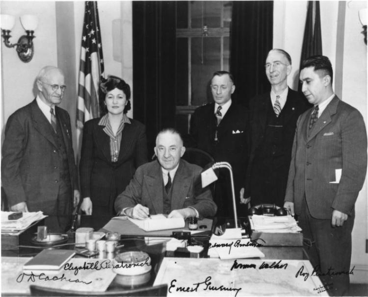 O.D. Cochran, Elizabeth Peratrovich, Edward Anderson, Norman Walker, and Roy Peratrovich at the signing of the Anti-Discrimination Act of 1945.