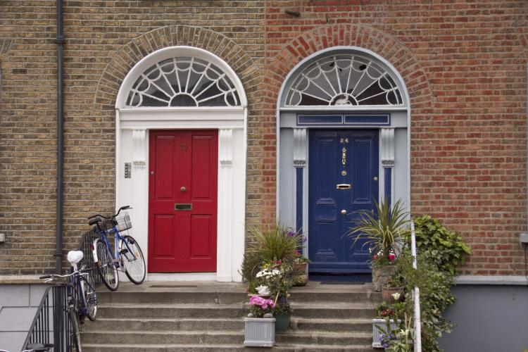 Red and blue neighbor doors in Dublin.