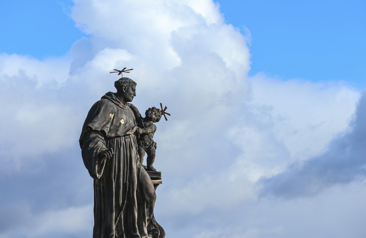 A statue of St Anthony with child Jesus.