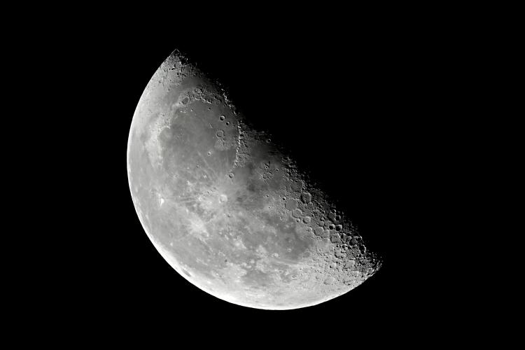 Close-up of a Half Moon or Third / Last Quarter Moon against a black night sky