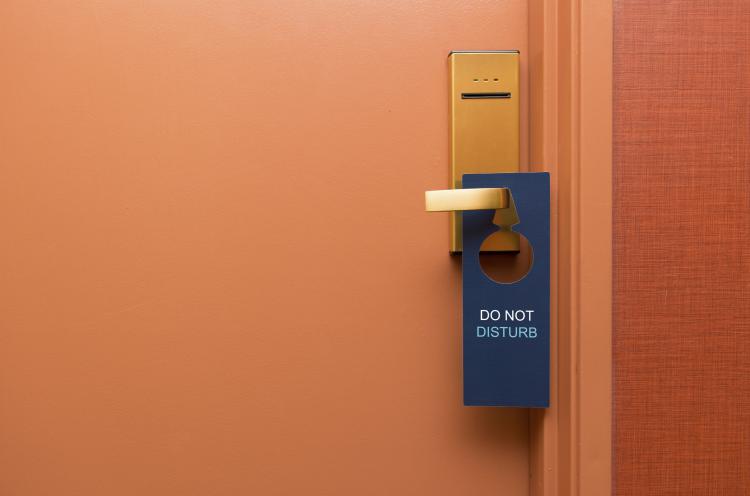 Do not disturb sign on a hotel door.