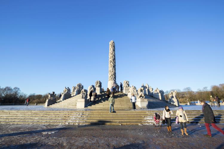 People walking by the Monolith statue in Frogner Park in Oslo on January 1.