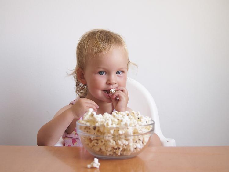Children and adults alike enjoy popcorn. Click to see more detail. Children and adults alike enjoy popcorn.
