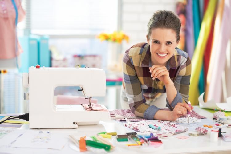 Woman with a sewing machine. Click to see more detail. Woman with a sewing machine.