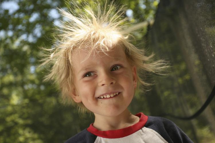 Boy with static hair sticking out.