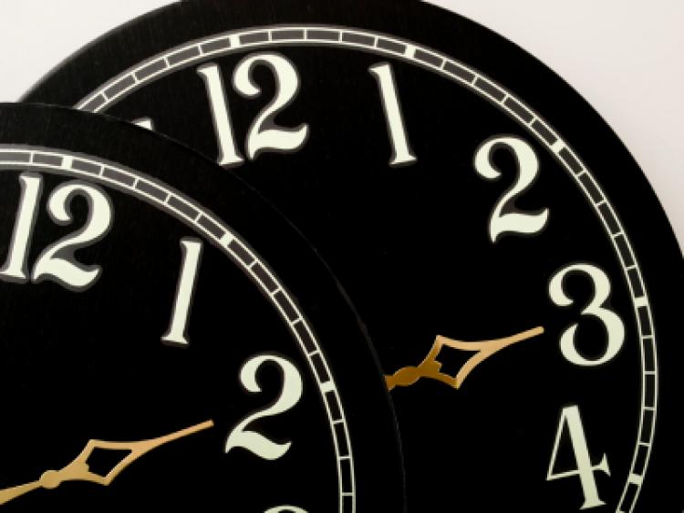 Two clock faces showing hours to adjust your clocks for Daylight Saving time.