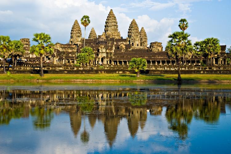 The Angkor Wat temple in Cambodia reflected in the water.