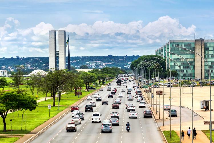 View of traffic on street next to Congresso Nacional (National Congress) building in Brasilia, capital of Brazil.