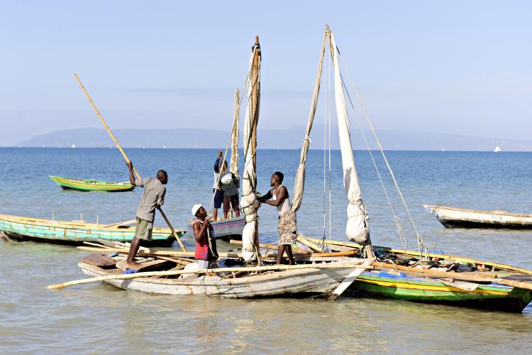Haitian fishermen in their boats preparing for a day of fishing off the shore near Saintard, Haiti.