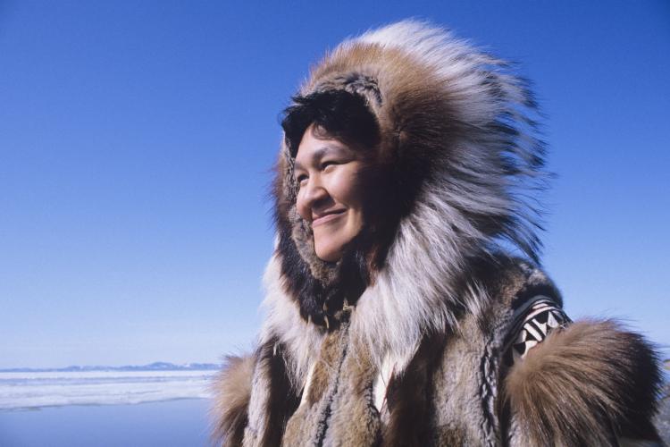Indigenous woman wearing traditional clothing.
