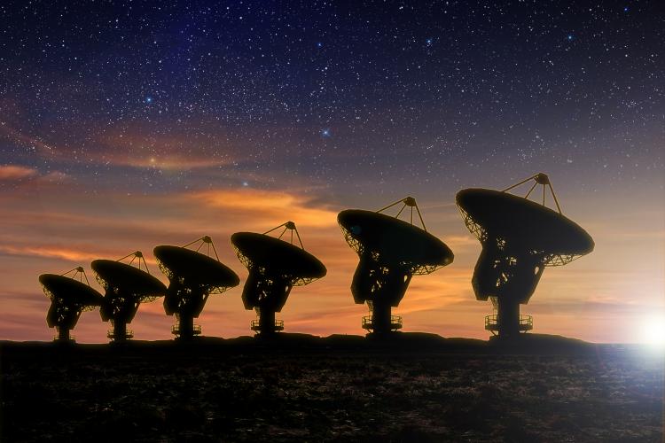 Radio telescopes at night.