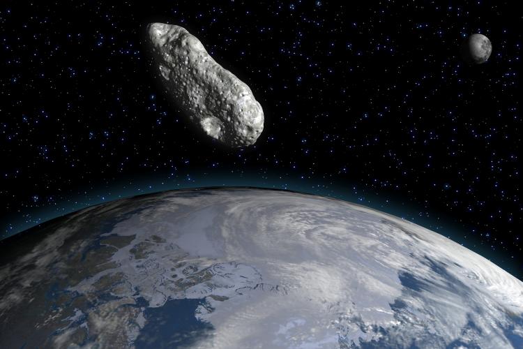 A 3-D rendering of an asteroid and the Earth by an artist.