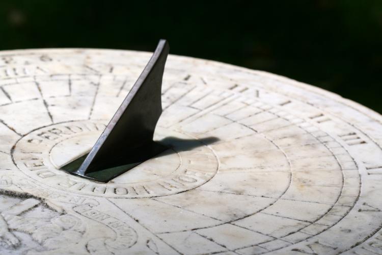 A sundial casting a shadow.