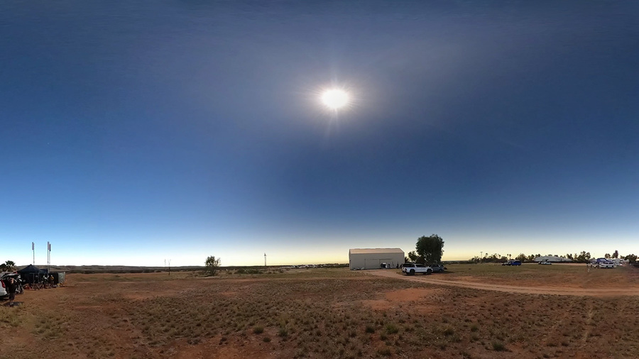 Photo of moon shadow sweeping out during total solar eclipse Exmouth, Australia