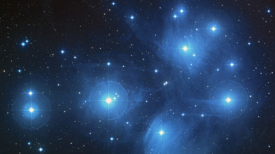 The color-composite image of the Pleiades star cluster.