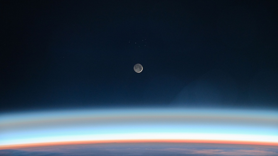 Image taken from the International Space Station showing a thin Waxing Crescent Moon illuminated by Earthshine.