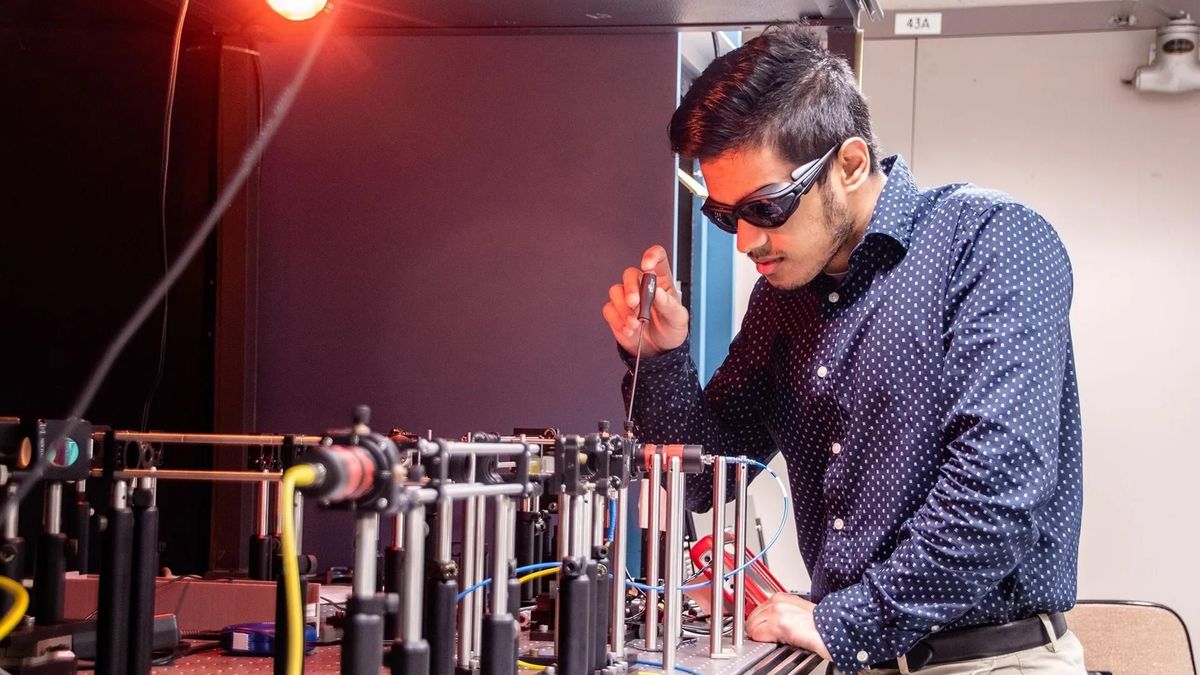 Space Communications and Navigation intern, Ashwin Mishra, testing equipment in the Quantum Communications Lab at NASA’s Glenn Research Center.