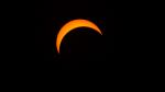 Only a thin crescent of the Sun is visible against a dark sky during this partial solar eclipse Malaysia on 9 March 2016.