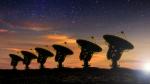 Radio telescopes at night.