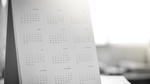 Blurred calendar page with Gregorian calendar