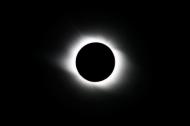 Total solar eclipse at its maximum point or totality. (Illustration) 