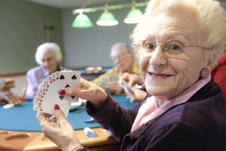 Senior adults playing bridge.