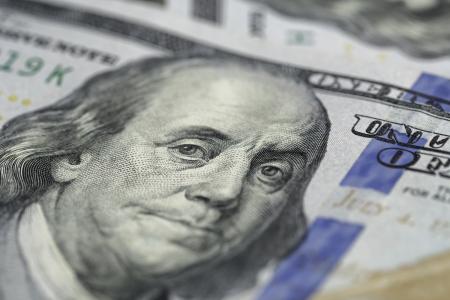 Benjamin Franklin on hundred dollar bill.